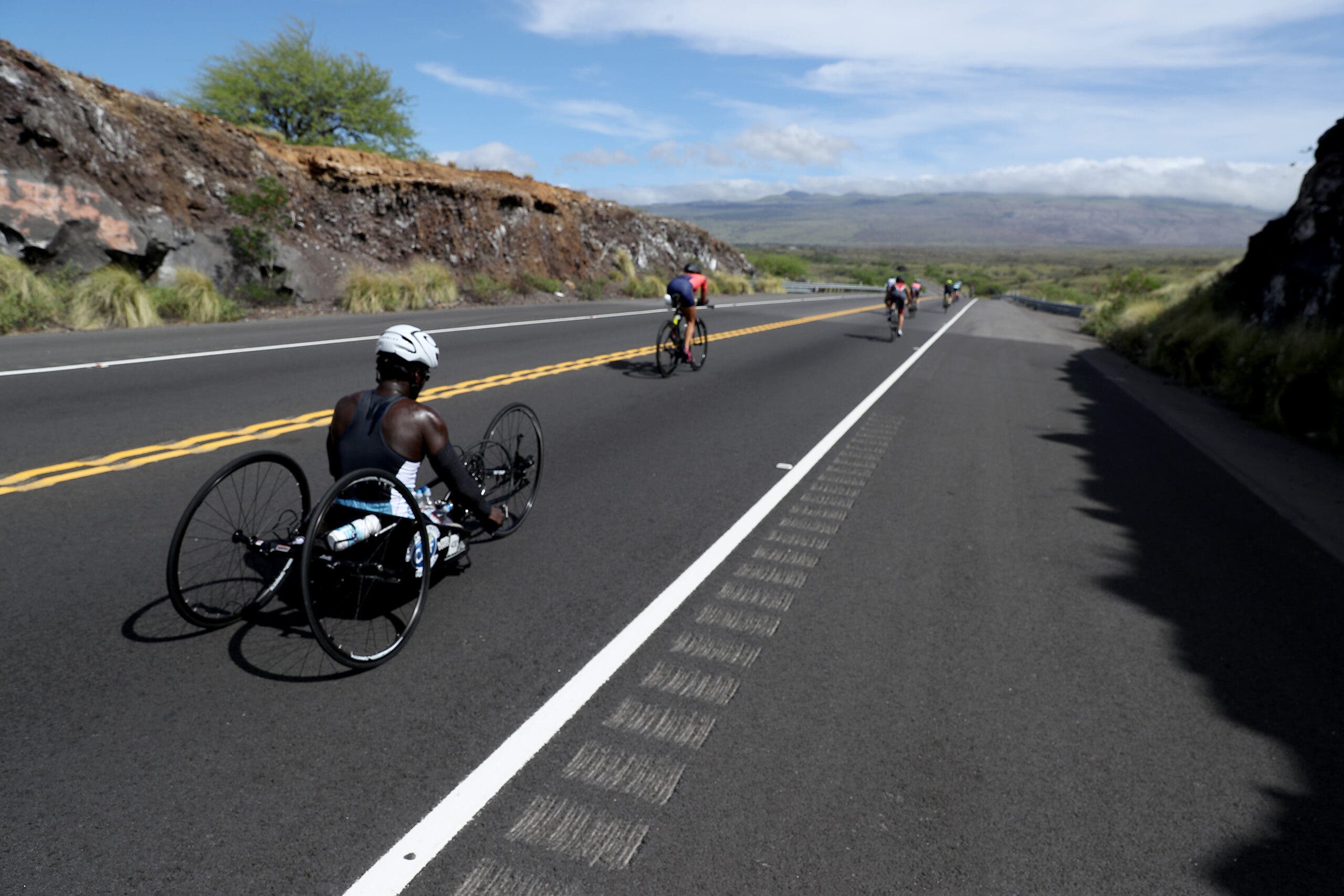 Athletes compete on the Ironman World Championship Kona bike cousre
