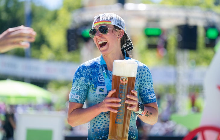 Fenella Langridge Triathlete with a beer after Challenge Roth