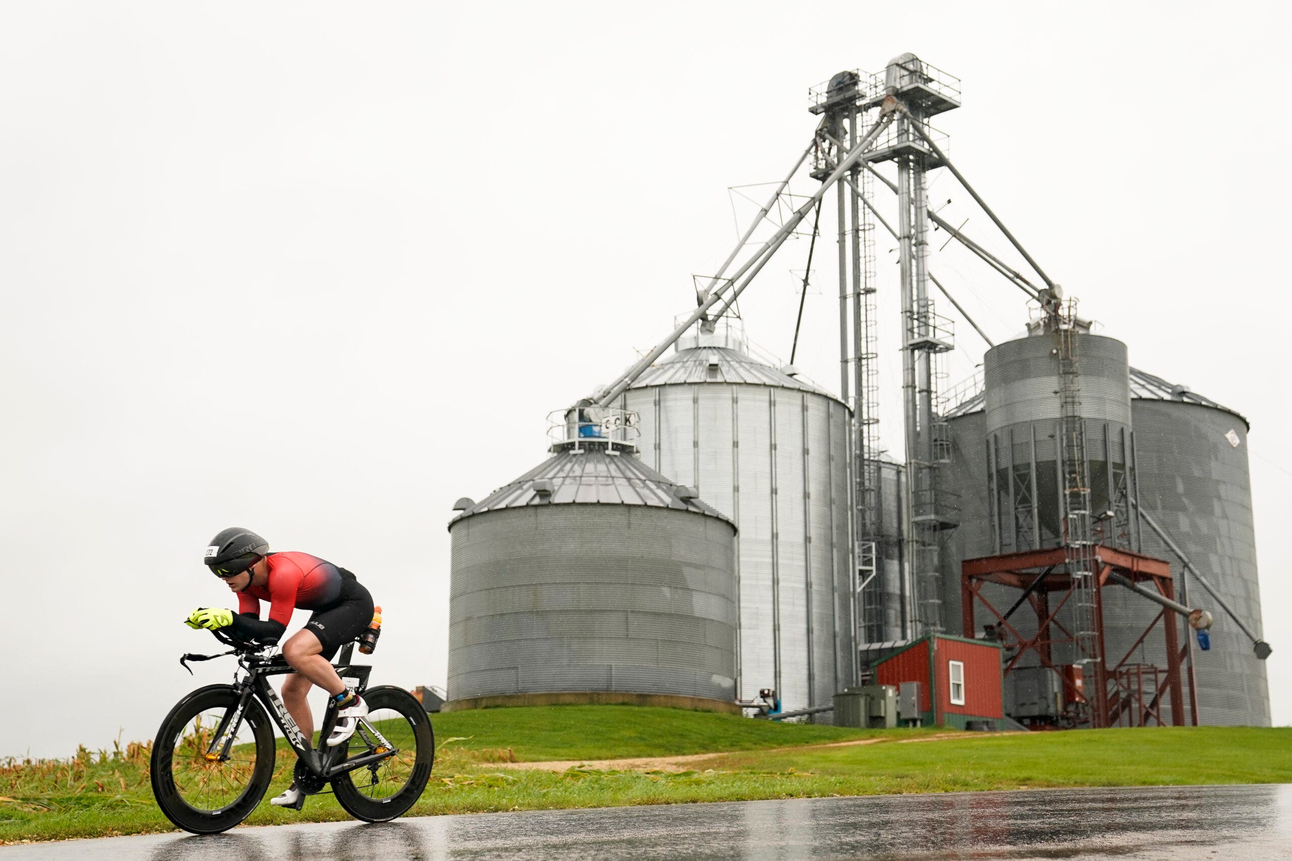 A triathlete rides in aero position during a triathlon