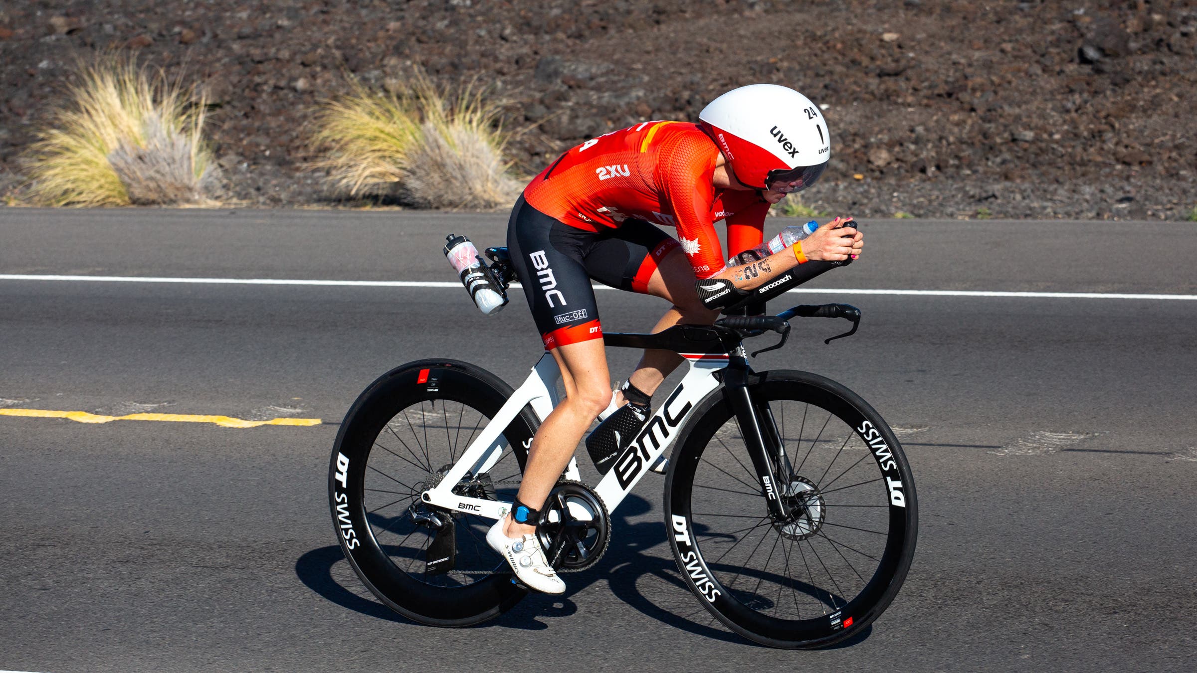Chelsea Sodaro rides a triathlon bike