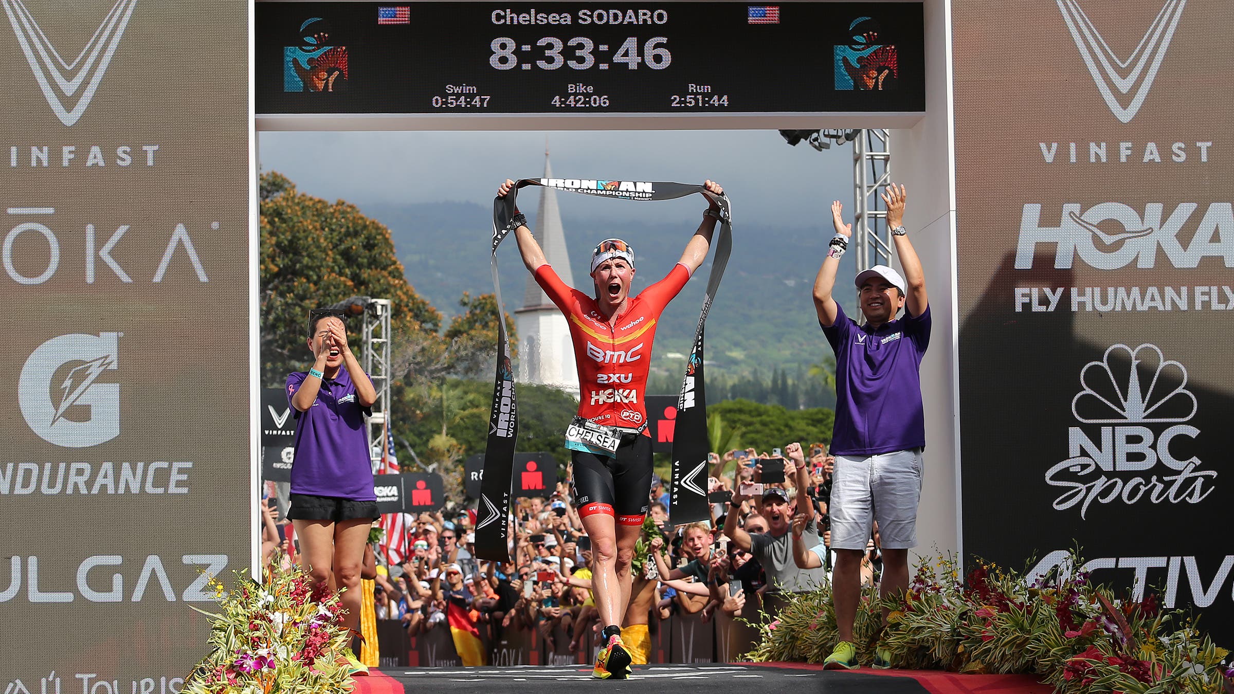 2022 Ironman World Champion Chelsea Sodaro crosses the finish line.