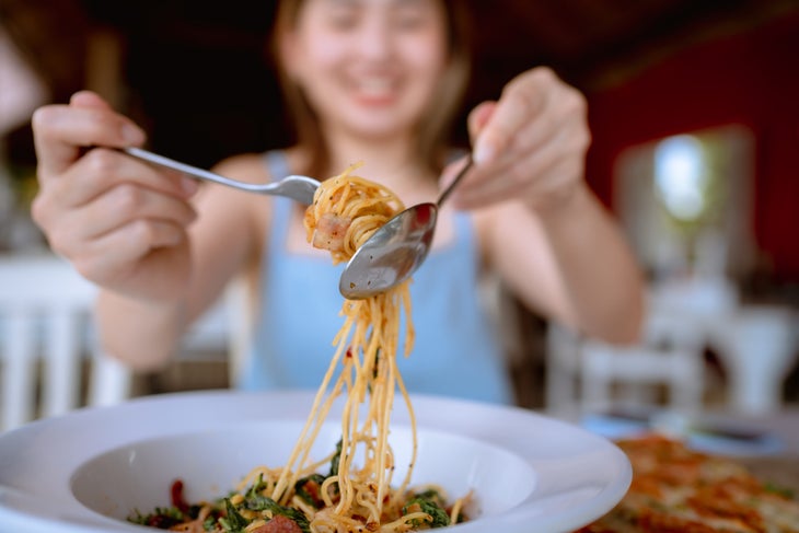 A woman eats carbs for mood