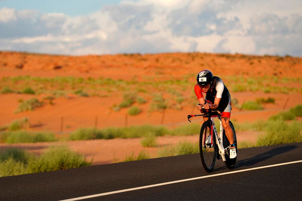 Tamara Jewett rides a triathlon bike at the 2021 Ironman 70.3 World Championship.