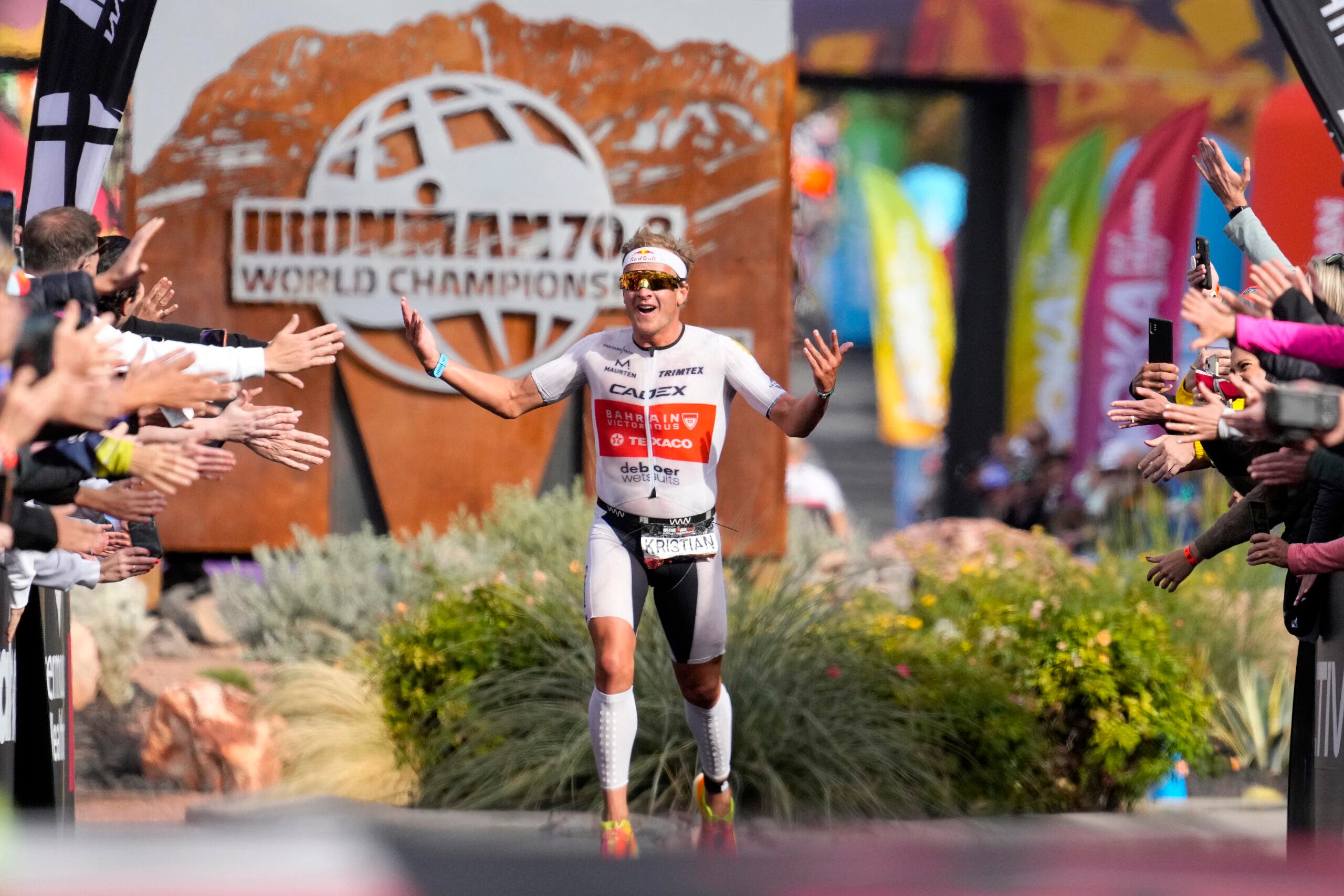 Kristian Blummenfelt celebrates his 2022 Ironman World Championship victory.