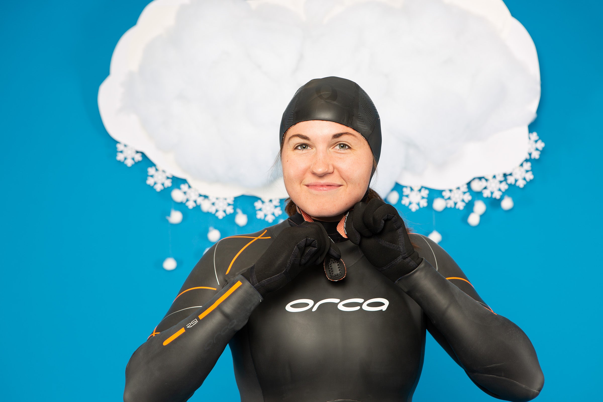 a model demonstrates What to wear for a cold open-water swim