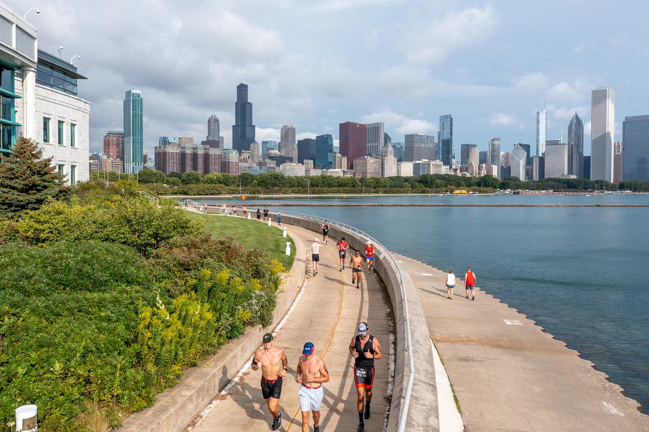 Triathletes race the Chicago Triathlon, one of the best sprint Olympic triathlons in the USA