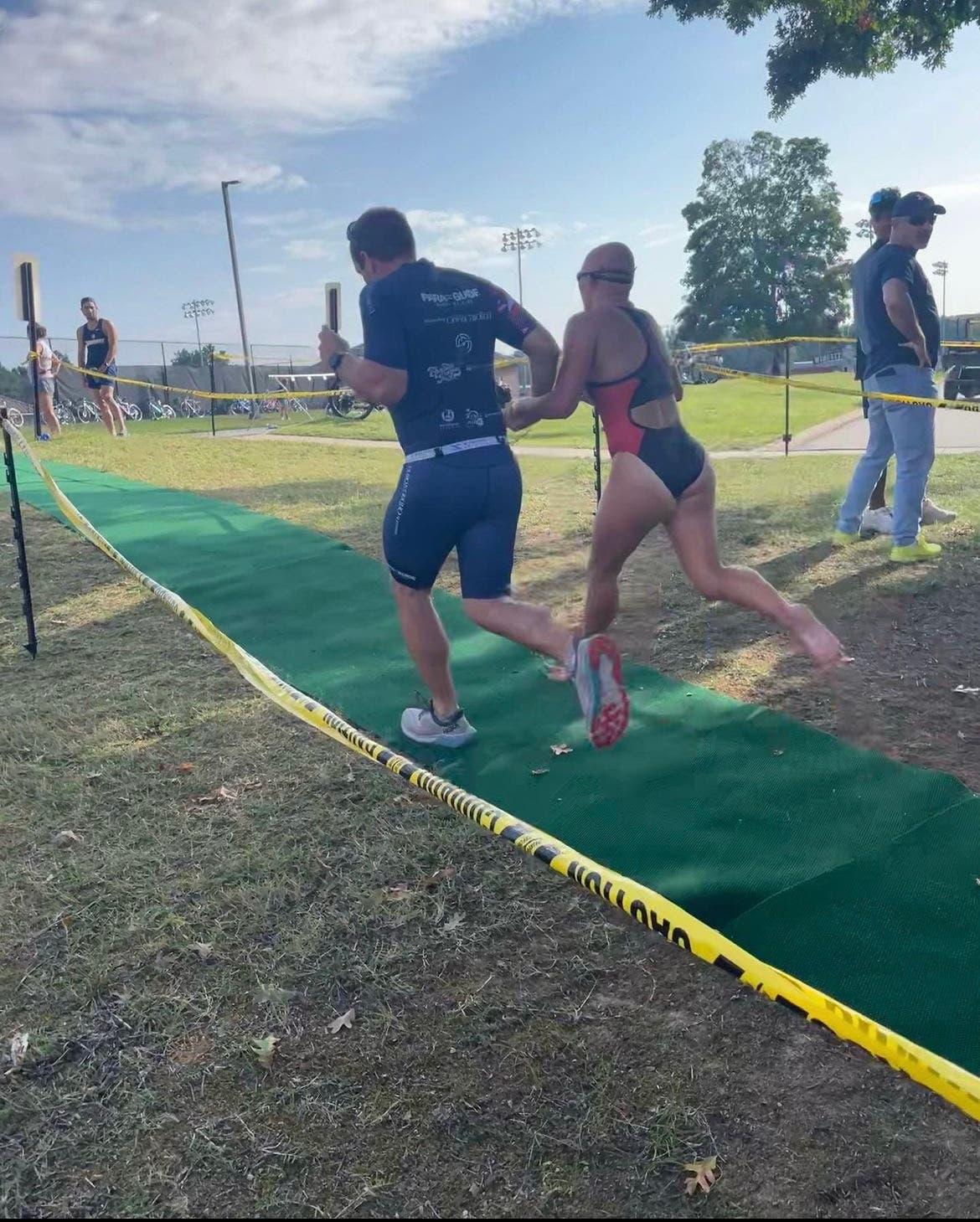Maggie Peters, a triathlete with a visual impairment, races a triathlon with the help of a sighted guide.