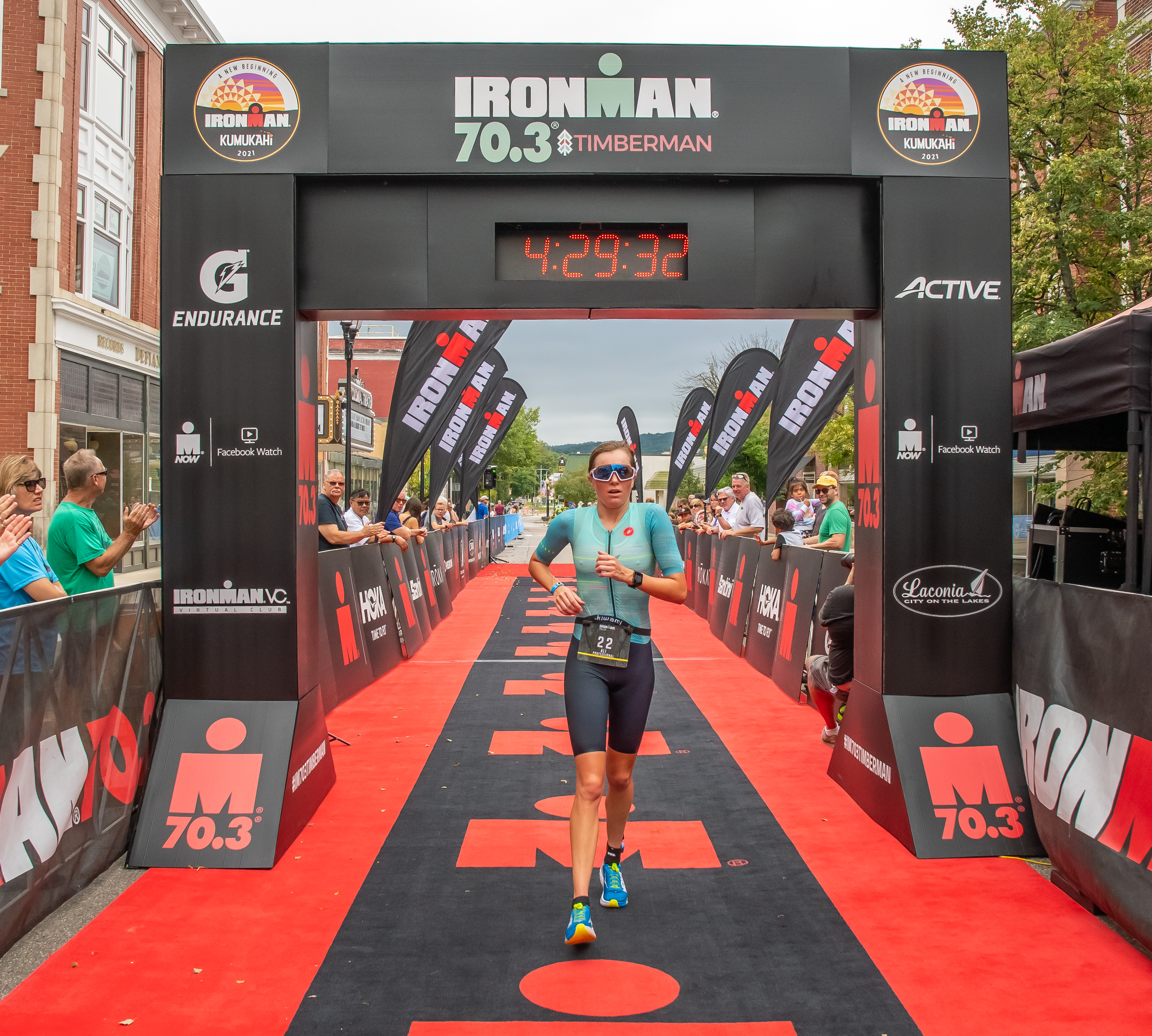 Ali Brauer, a triathlete, crosses a finish line. She is tired from overtraining and RED-S.