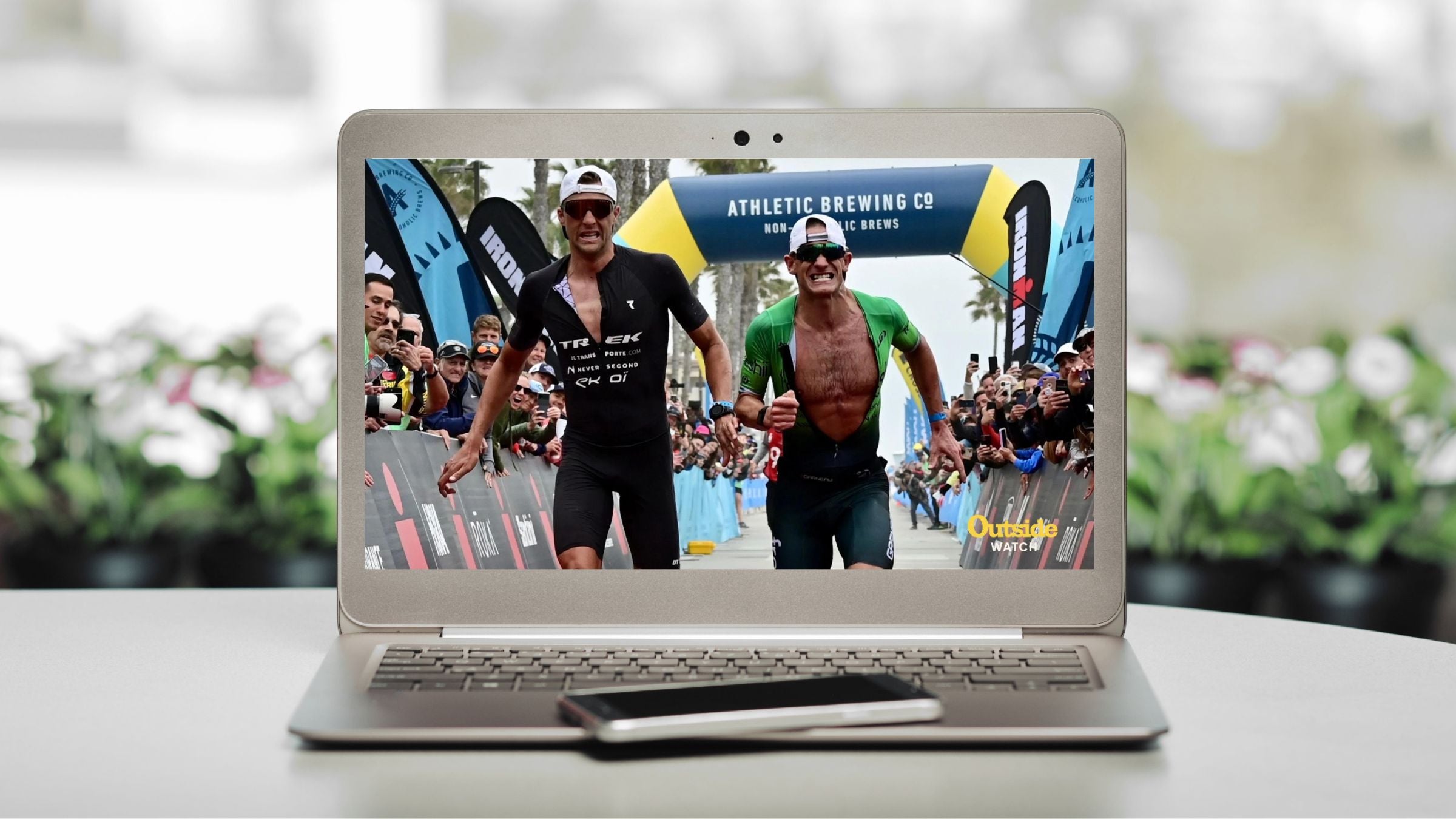 A laptop playing Outside Watch, part of the Triathlete Magazine subscription
