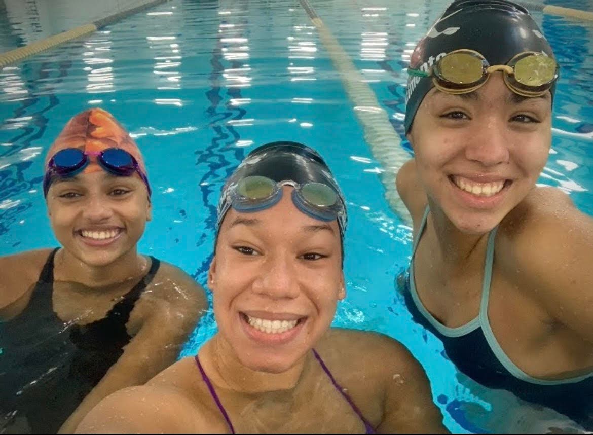 Members of the Naugatuck High School Triathlon team take a selfie before going for a swim.