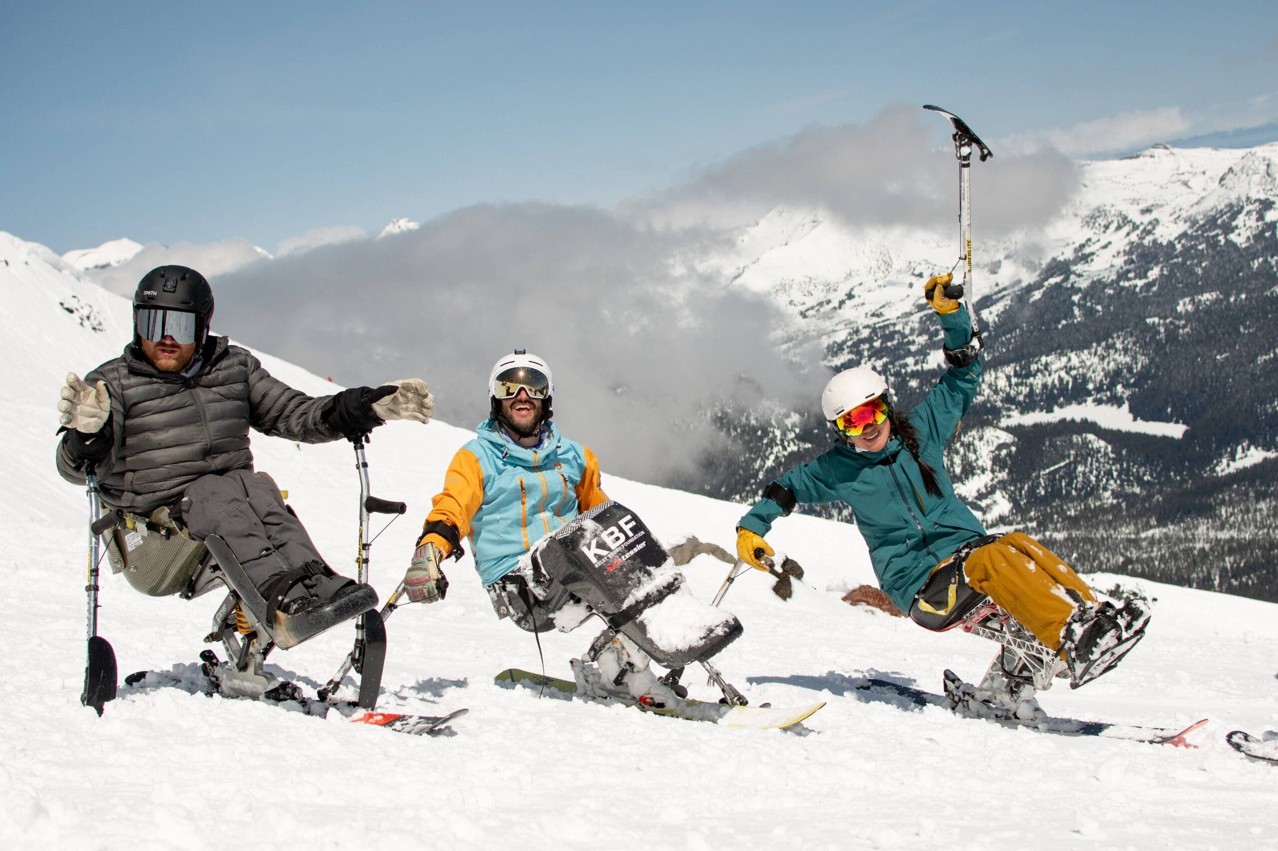 Adaptive athletes riding a monoski