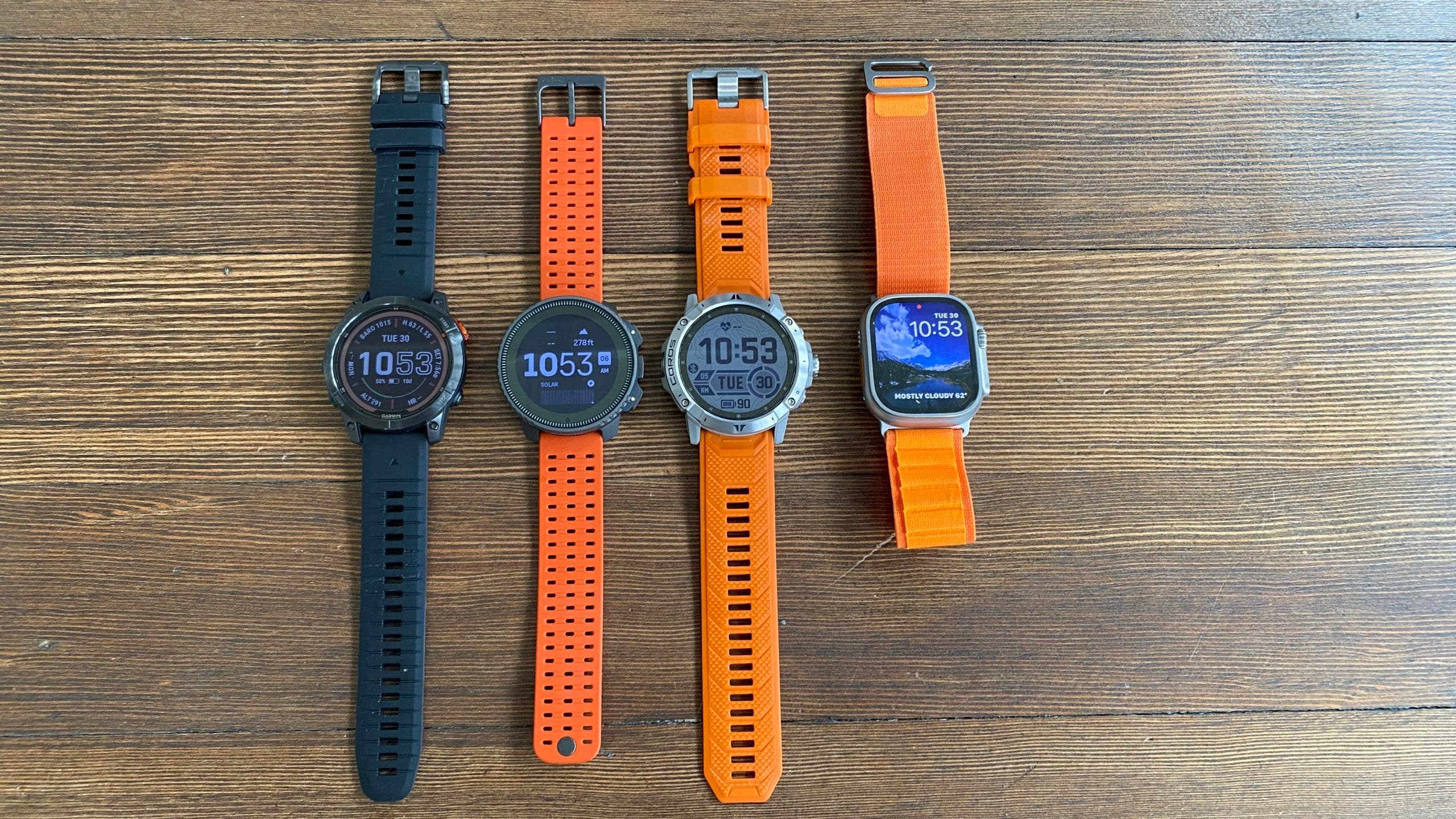Suunto Vertical and Garmin Fenix 7 Pro next to the apple watch