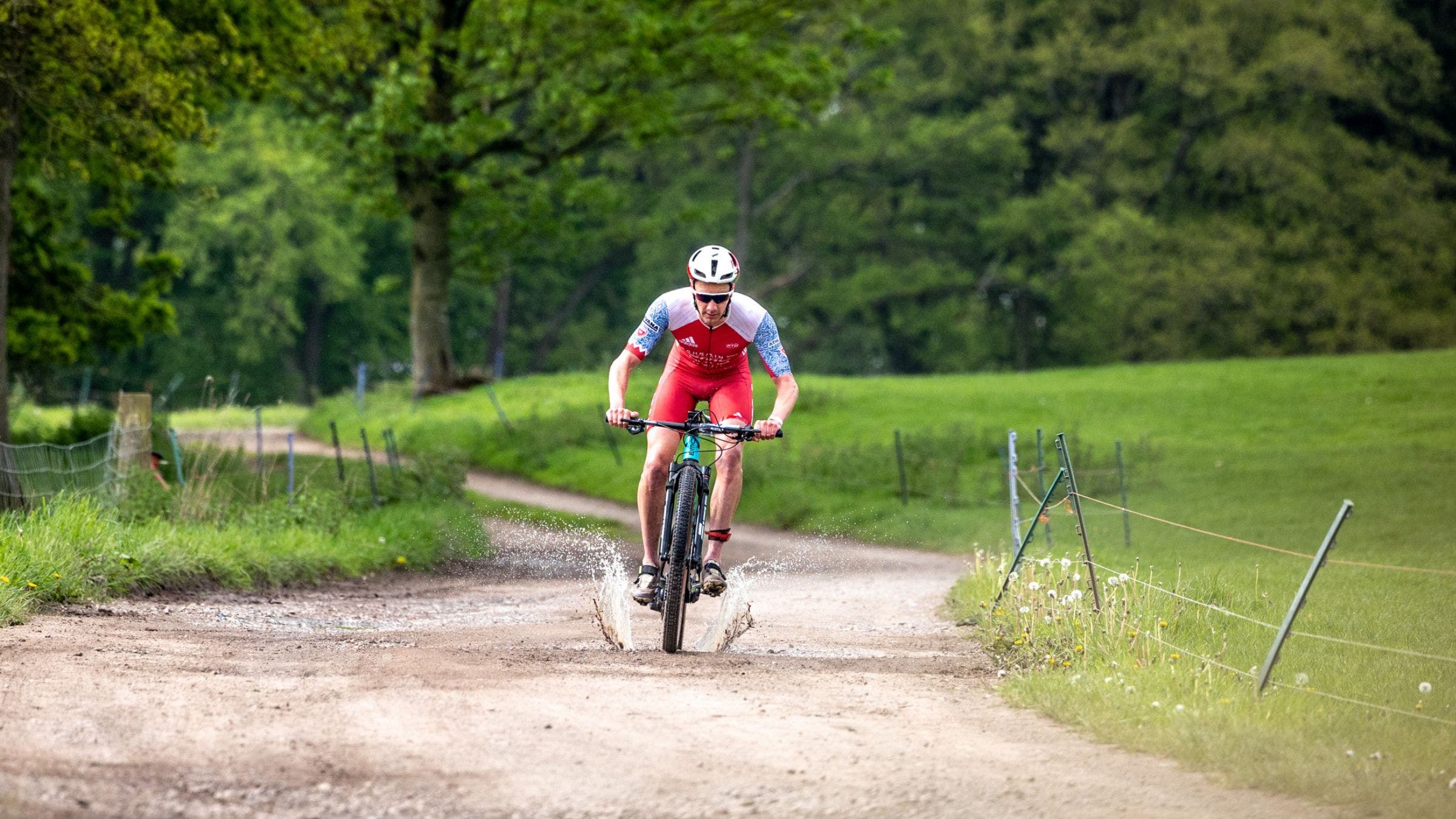 Ali Brownlee races a mountain bike in an XTERRA triathlon.