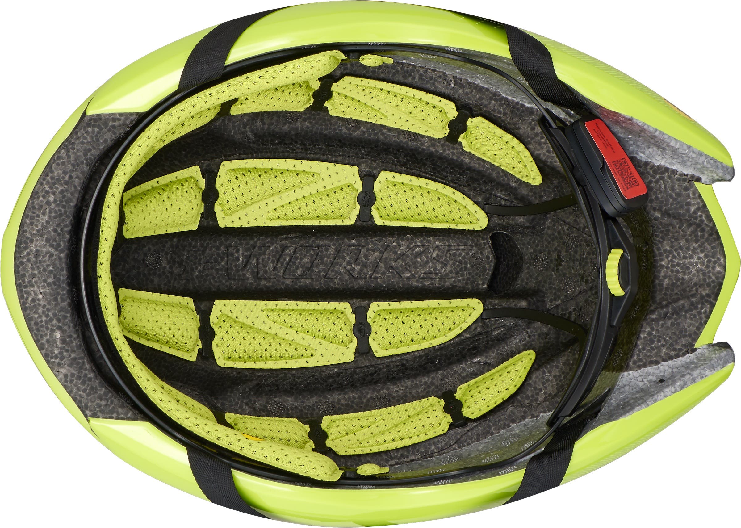 Yellow cushions on the inside of a yellow bike helmet with MIPS.