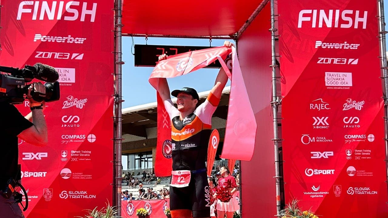 Mathis Margirier holds up a finish line ribbon at the Challenge Championship 2023