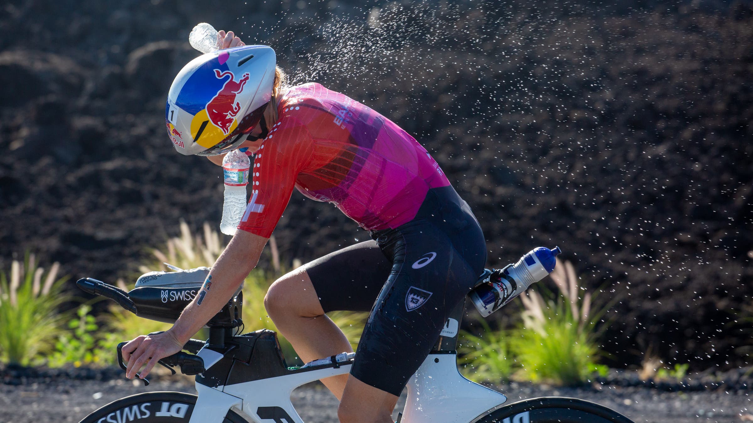 Daniela Ryf sprays herself with water during Kona 2022