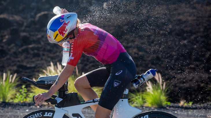 Daniela Ryf sprays herself with water during Kona 2022