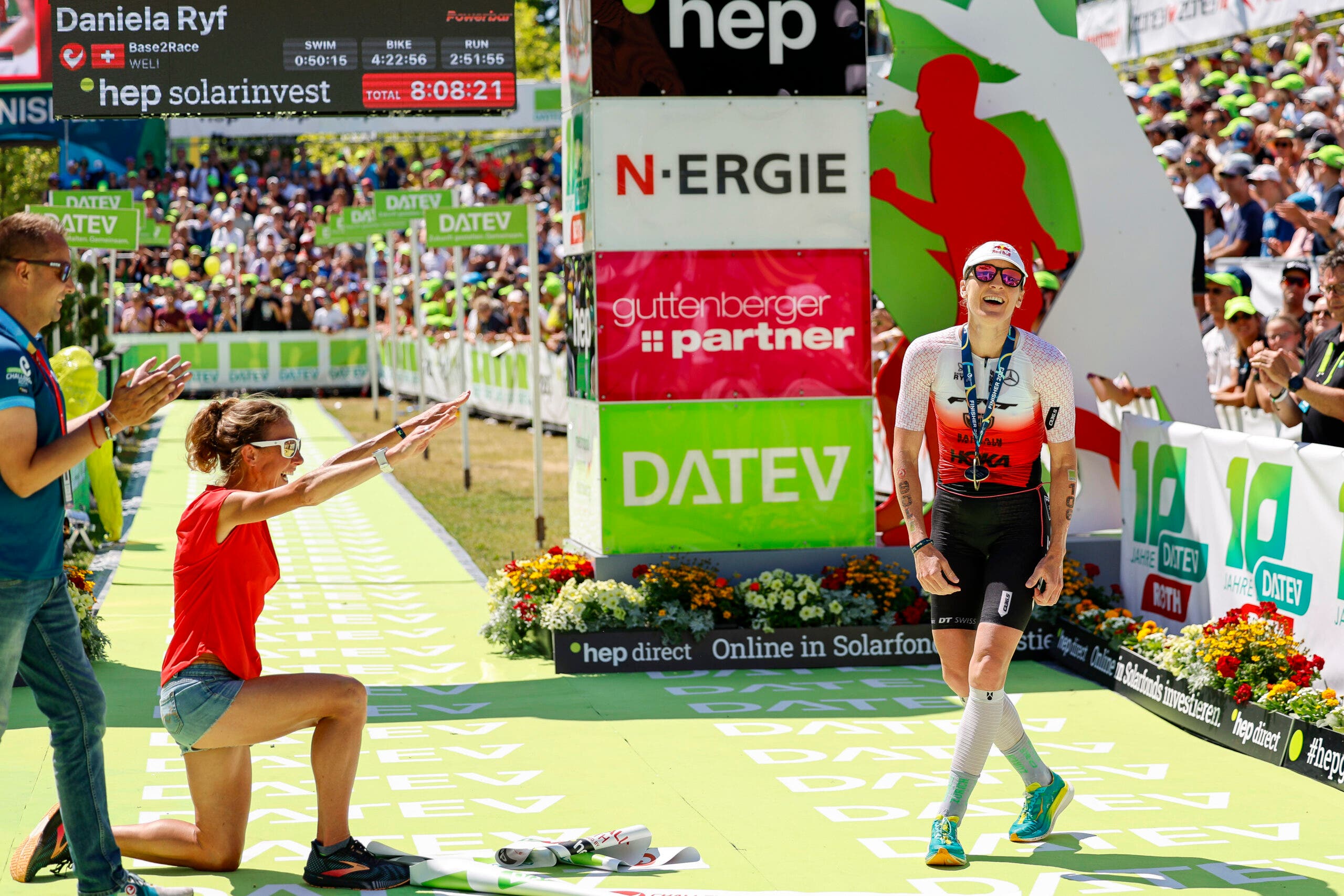 Chrissie Wellington celebrates Daniela Ryf at the finish line in Roth.