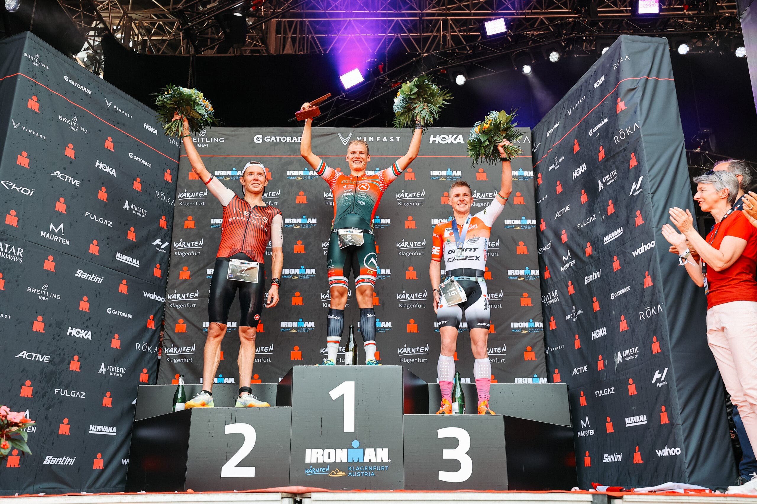 Cameron Wurf of Australia, Mathias Peterson of Denmark and Georg Enzenberger of Austria pose on the podium after Ironman Austria.