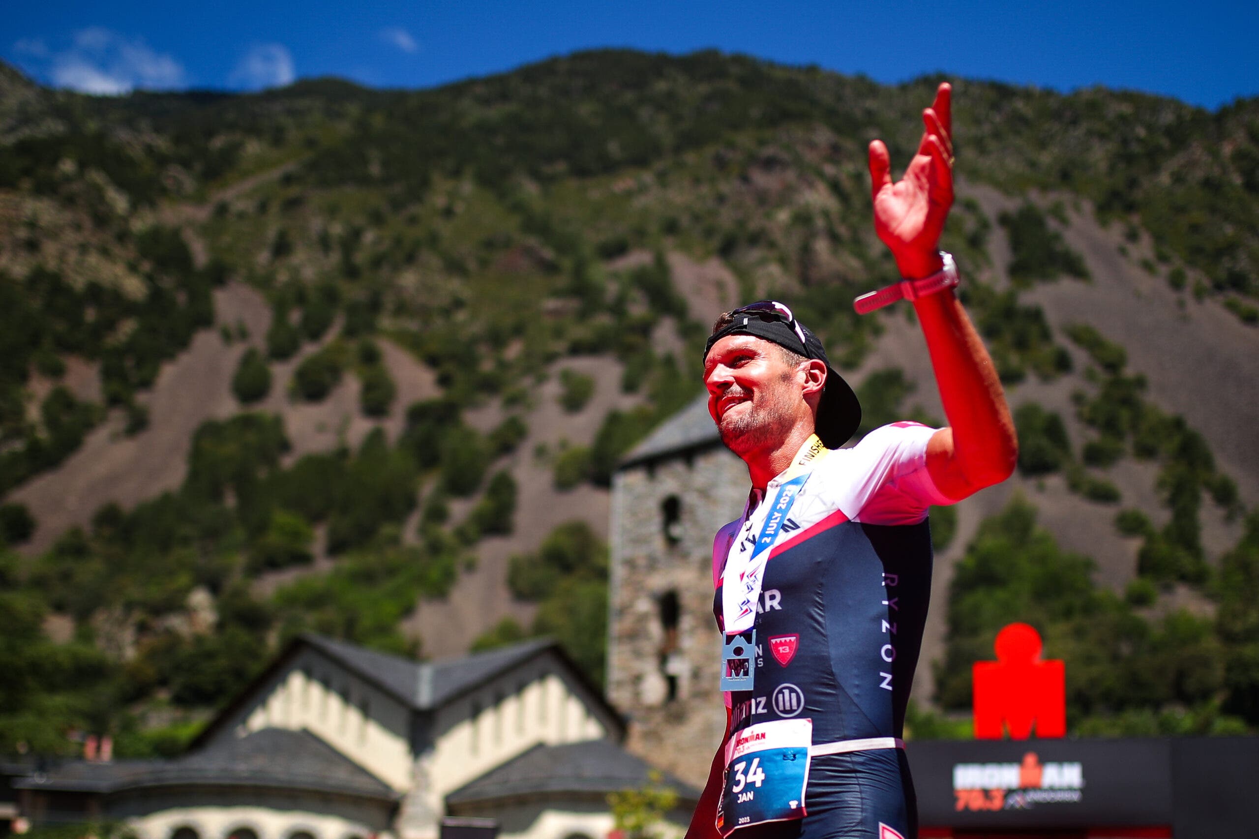 Jan Frodeno of Germany celebrates winning the men's race at Ironman 70.3 Andorra.