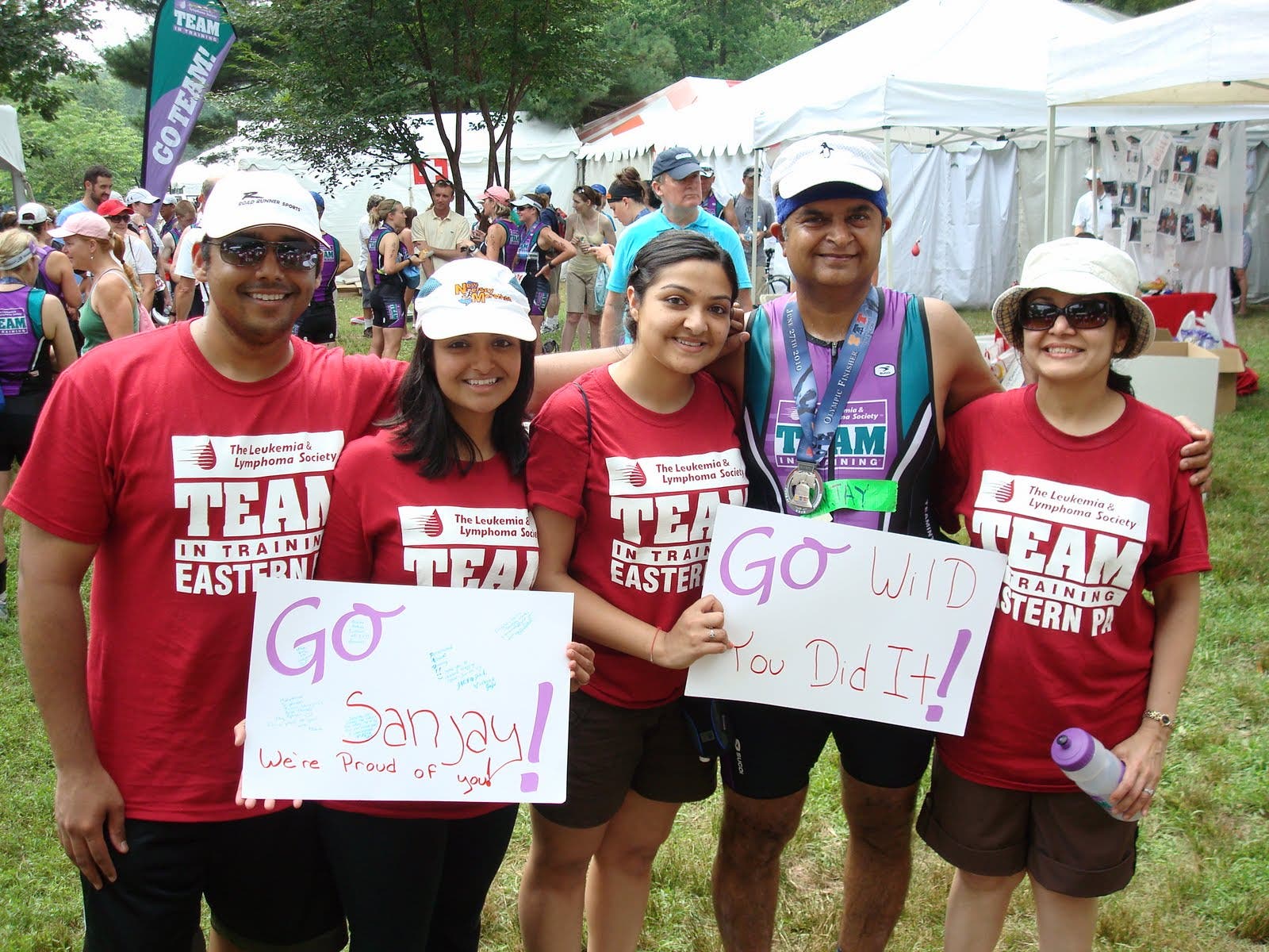 Sanjay Shah celebrates with family members at a triathlon he did after diabetes and heart surgery