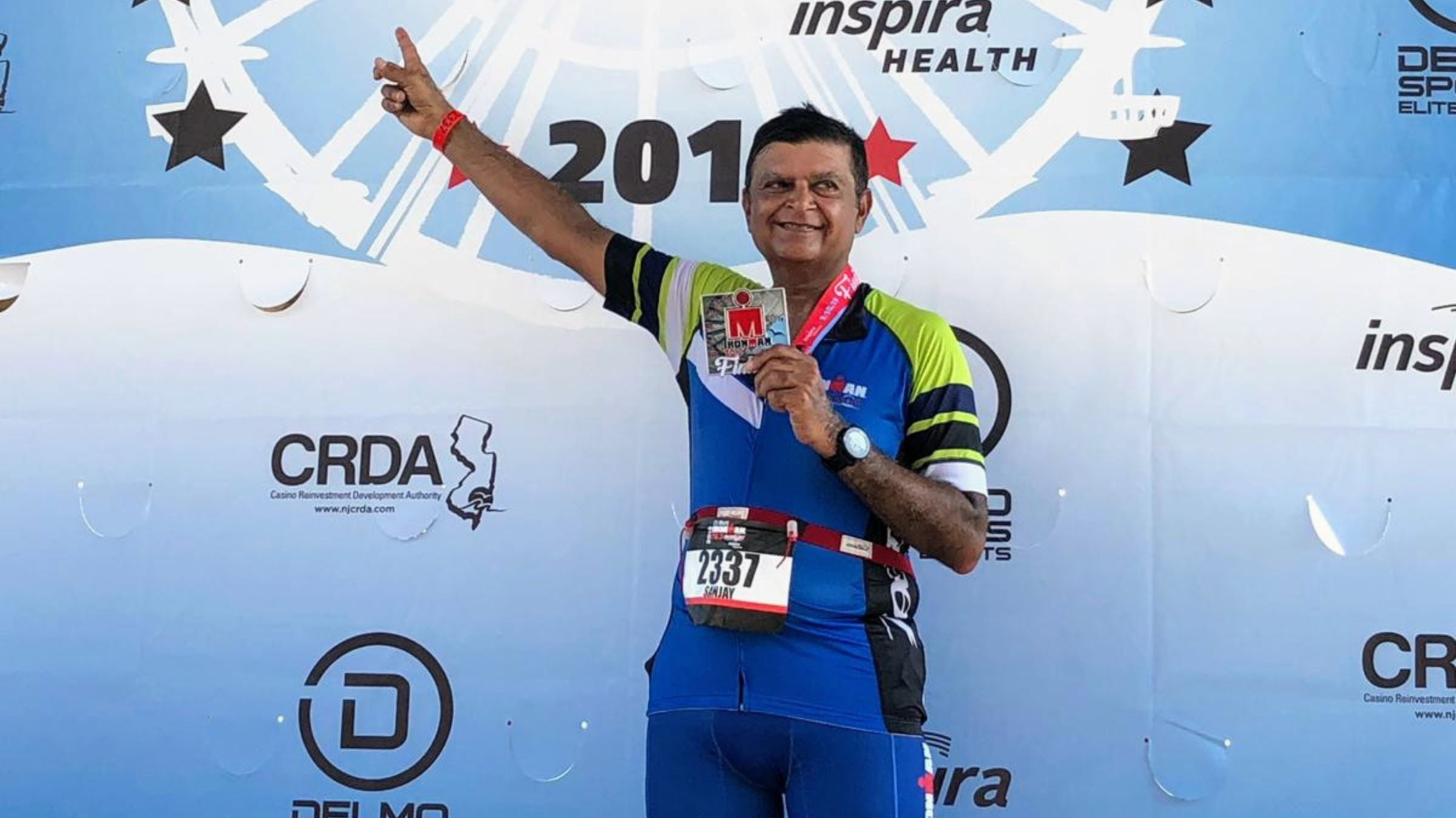 Sanjay Shah celebrates after finishing a 70.3 after diabetes and heart surgery
