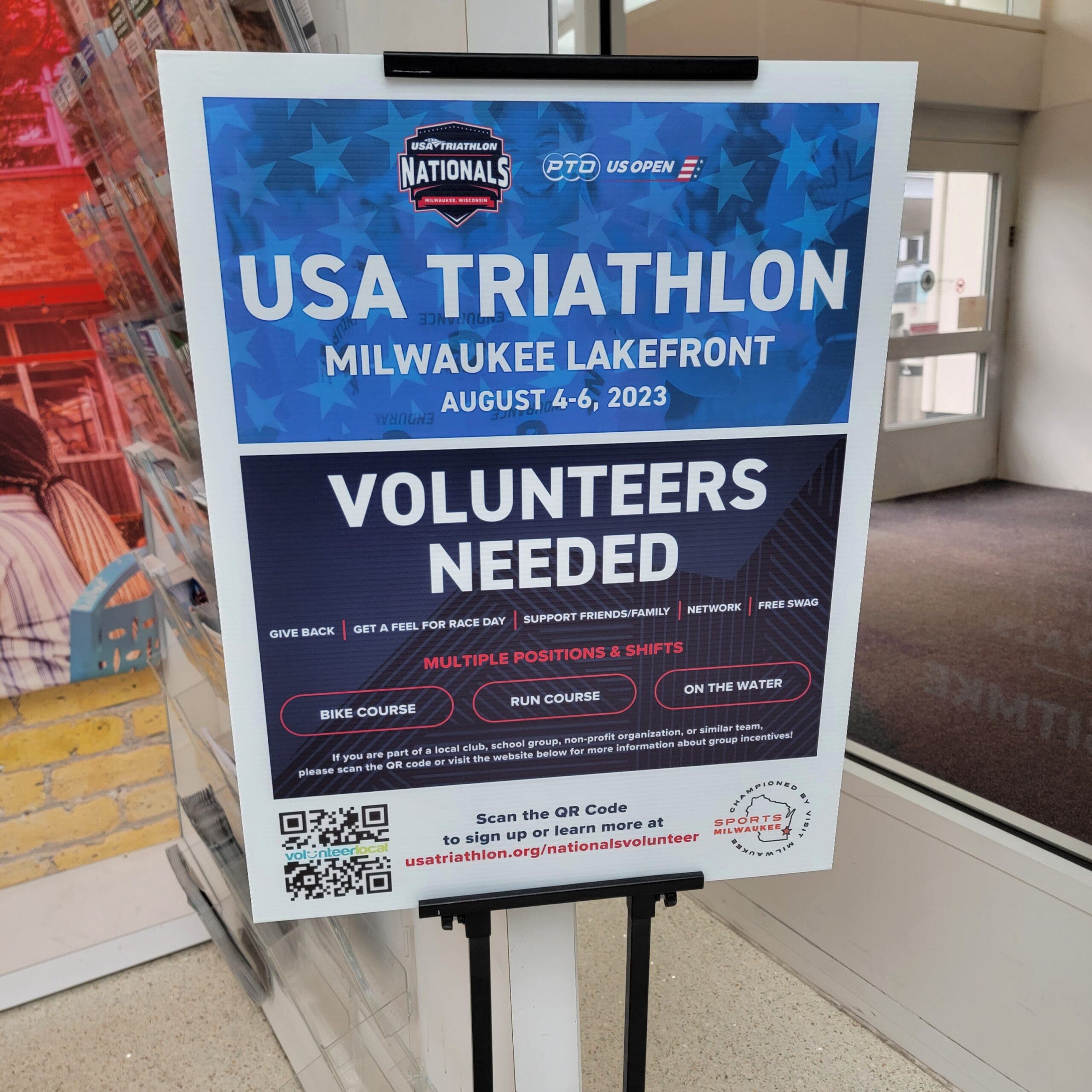 A sign at General Mitchell International Airport in Milwaukee, Wisconsin asks for volunteers for the USA Triathlon National Championships.