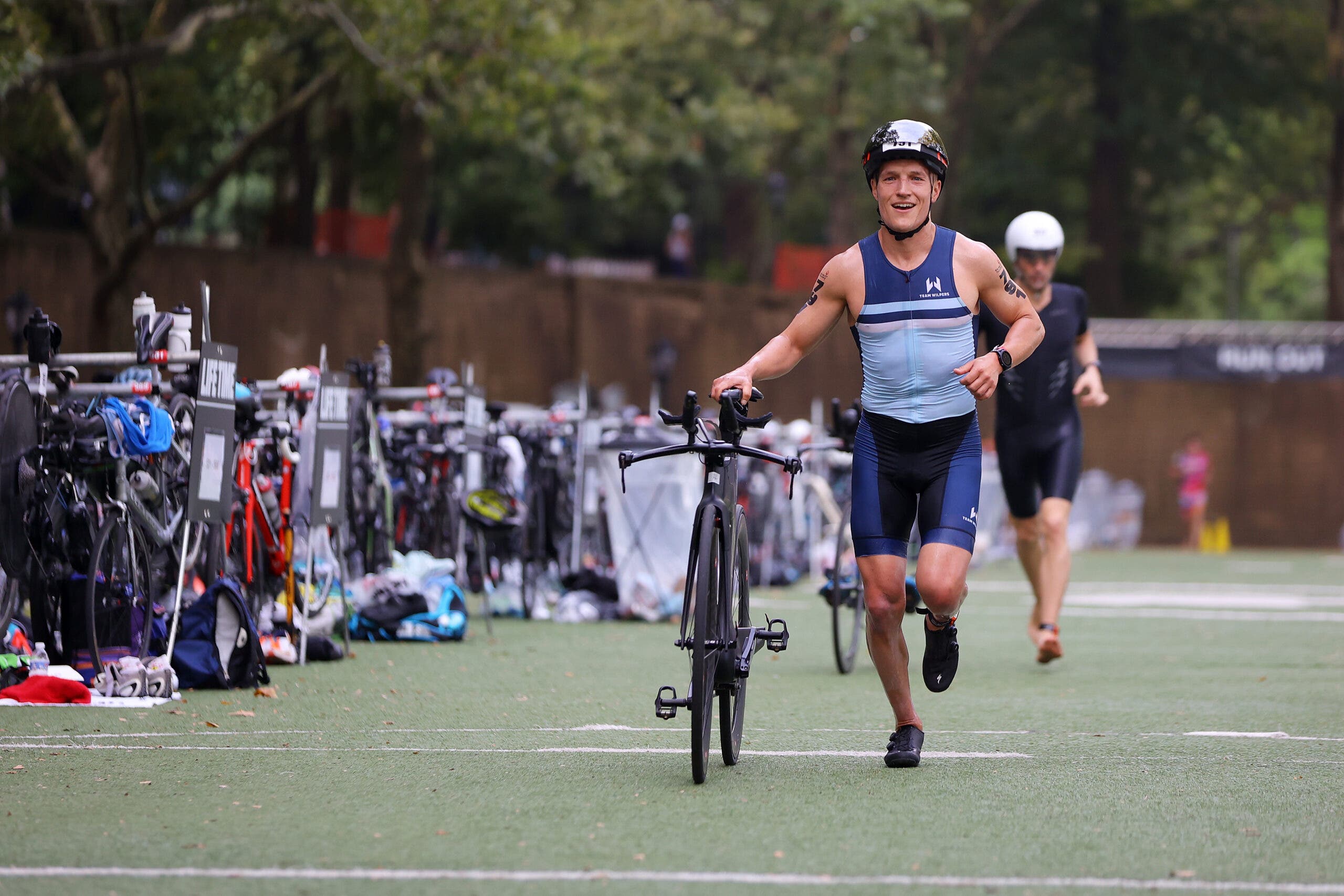 A triathlete exits T1 to begin the New York City Triathlon bike course.