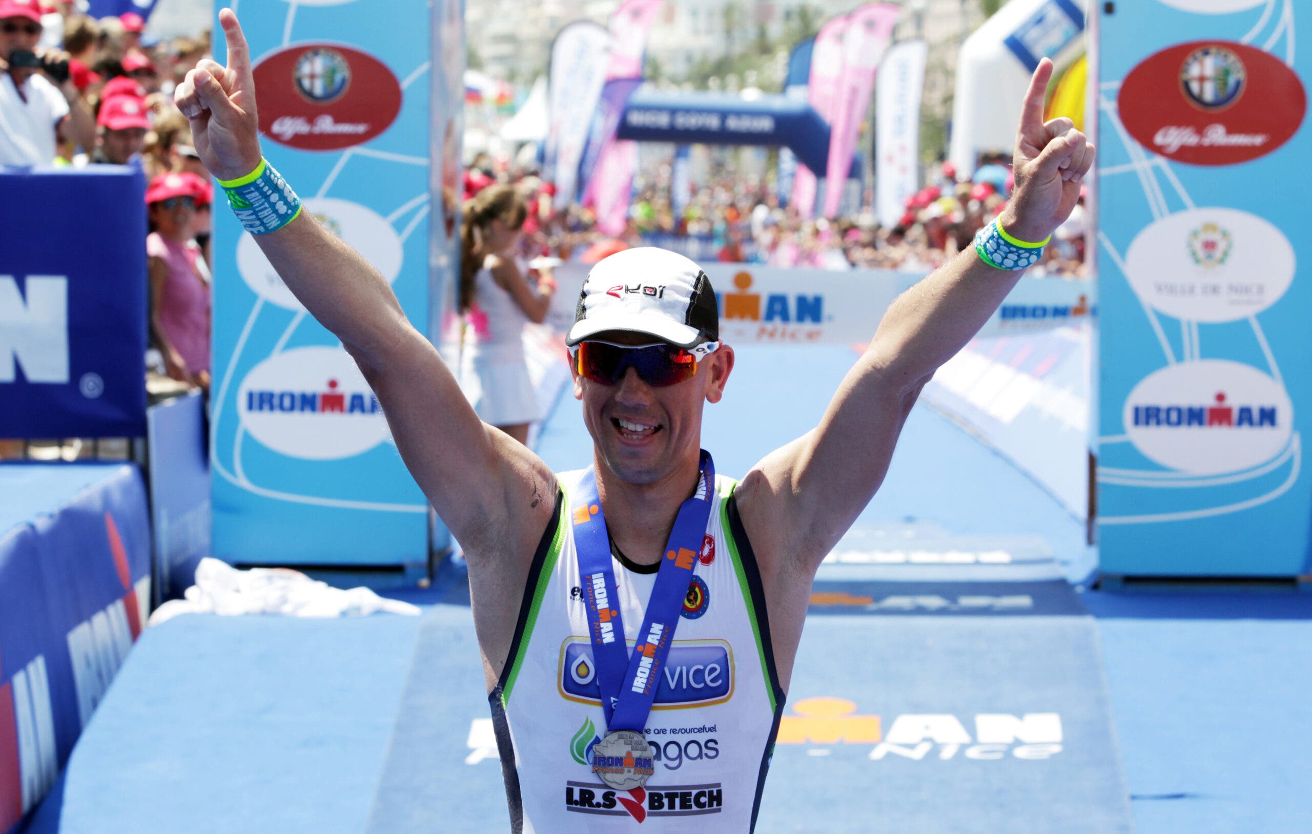 French triathlete Frederic Van Lierde celebrates after winning Ironman France 2013.