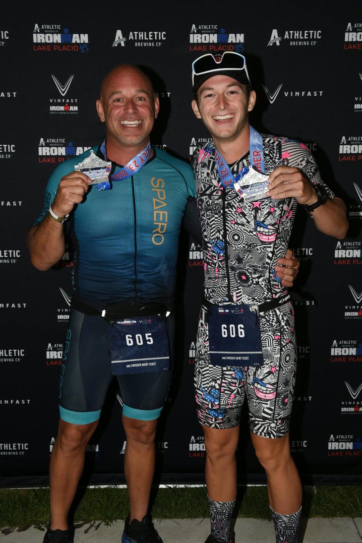 Chris Catullo (R) and his son, Nicholas (L) after finishing Ironman Lake Placid and qualifying for the 2023 World Championship.
