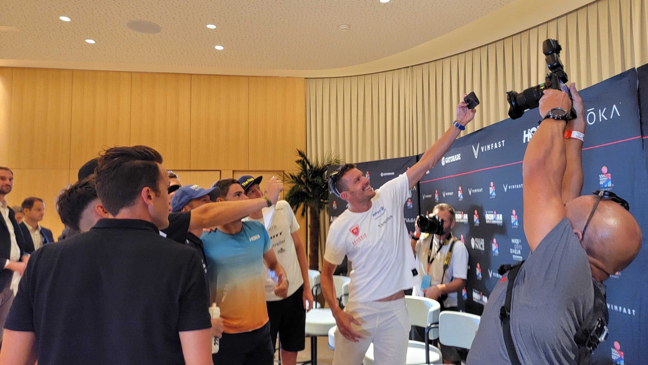 Jan Frodeno takes a selfie with his fellow contenders after the pre-race press conference for the 2023 men's Ironman World Championship in Nice, France.