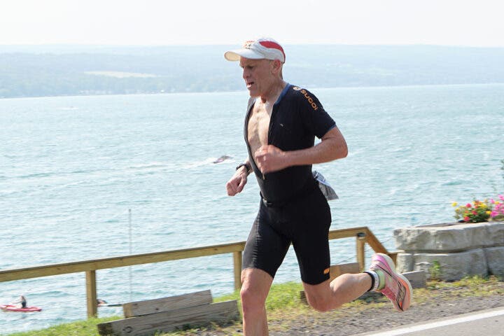 An athlete competes in the run portion of the Peasantman Triathlon.