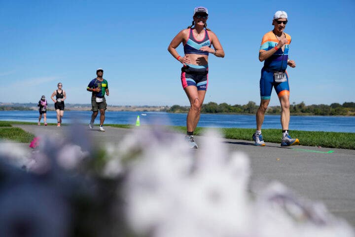 Age group athletes compete on the run course at 2024 IRONMAN 70.3 Washington Tri-Cities on September 22, 2024 in Richland, Washington.