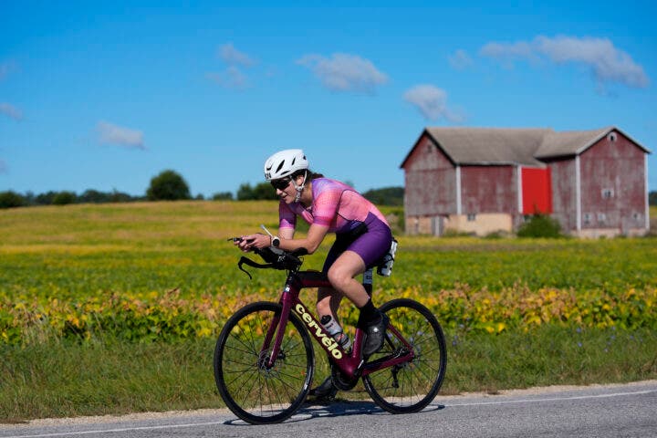 A female athlete competes during the bike portion of Ironman 70.3 Wisconsin.