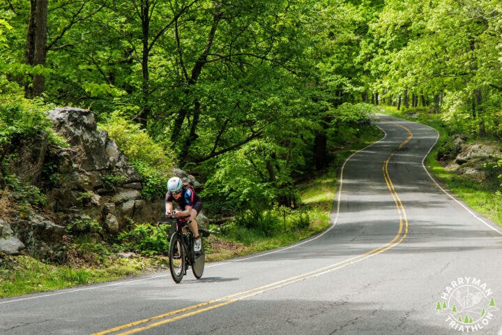 An athlete bikes along the HarryMan Triathlon course, one of the best sprint and Olypmic races in the U.S. for 2025.