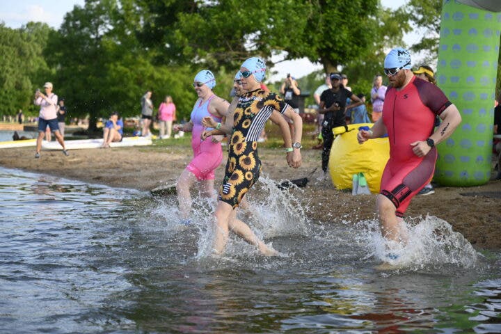 Athletes enter the water at the St. Louis Triathlon, one of the best beginner races of 2025.