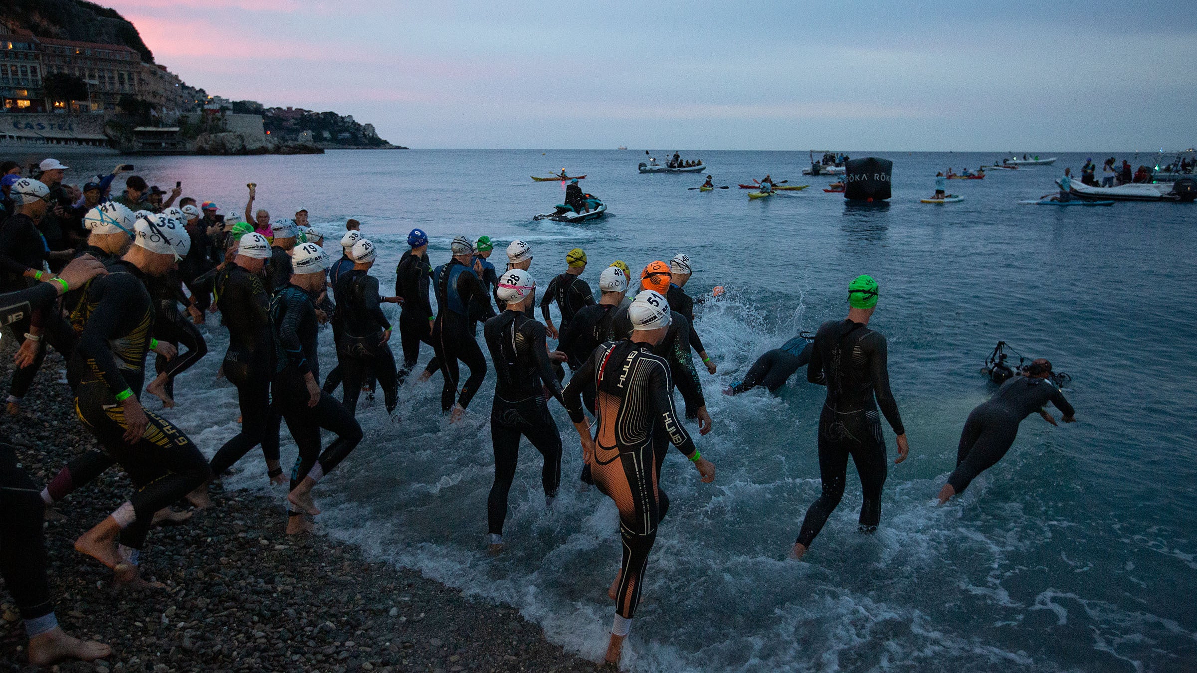 Pro athletes enter the water to begin the 2024 Ironman World Championship race in Nice, France.