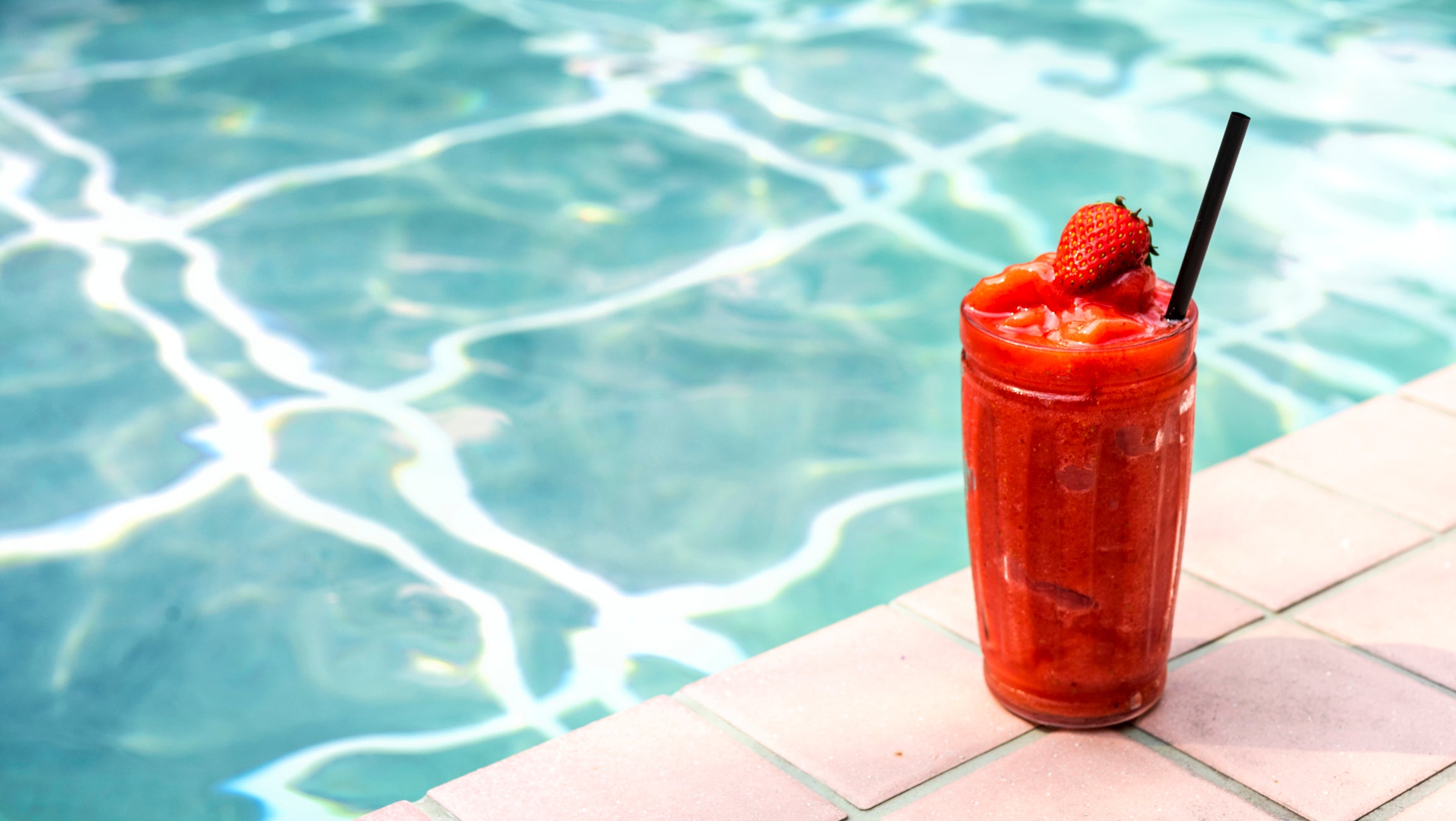 Sit poolside (post swim workout, of course) with this rehydrating strawberry daiquiri mocktail recipe.