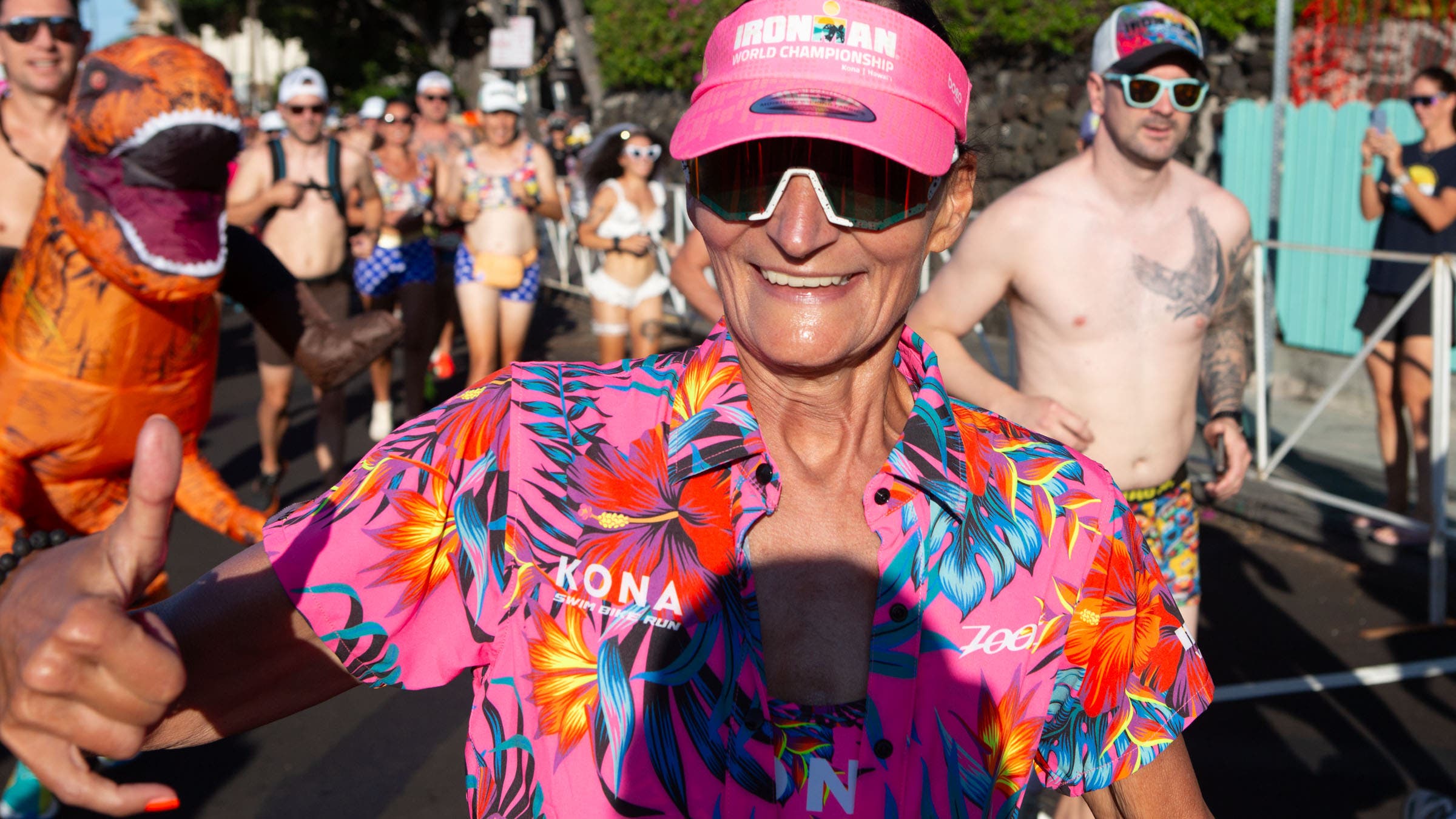 She's hanging loose, even though a dinosaur is closing in behind her.