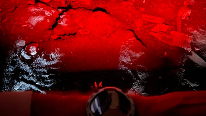 All versions of the Instinct 3 have a built-in LED flashlight in the top of the case. The LED can be set to on, strobe, or red (pictured).