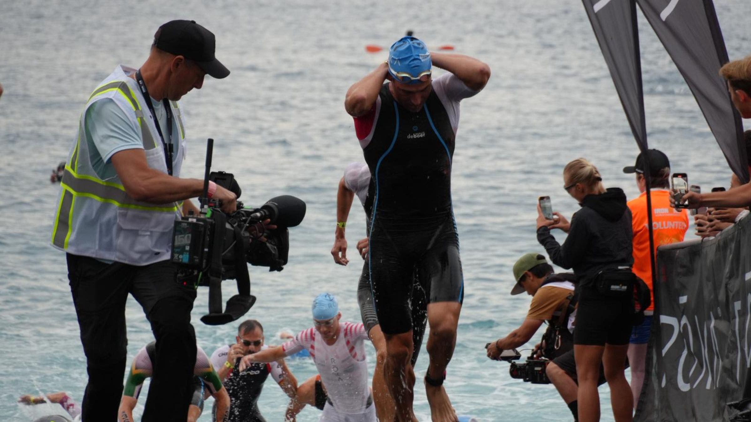 The lead group of men emerge from the Mediterranean at the 2025 Ironman World Championship. Among the front group was eventual winner, Casper Stornes (NOR).