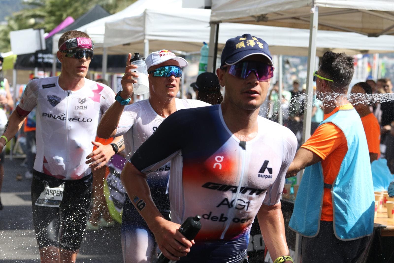 The Norwegian trio of (R-L) Gustav Iden, Kristian Blummenfelt, and Casper Stornes lead the men's 2025 Ironman World Championship.