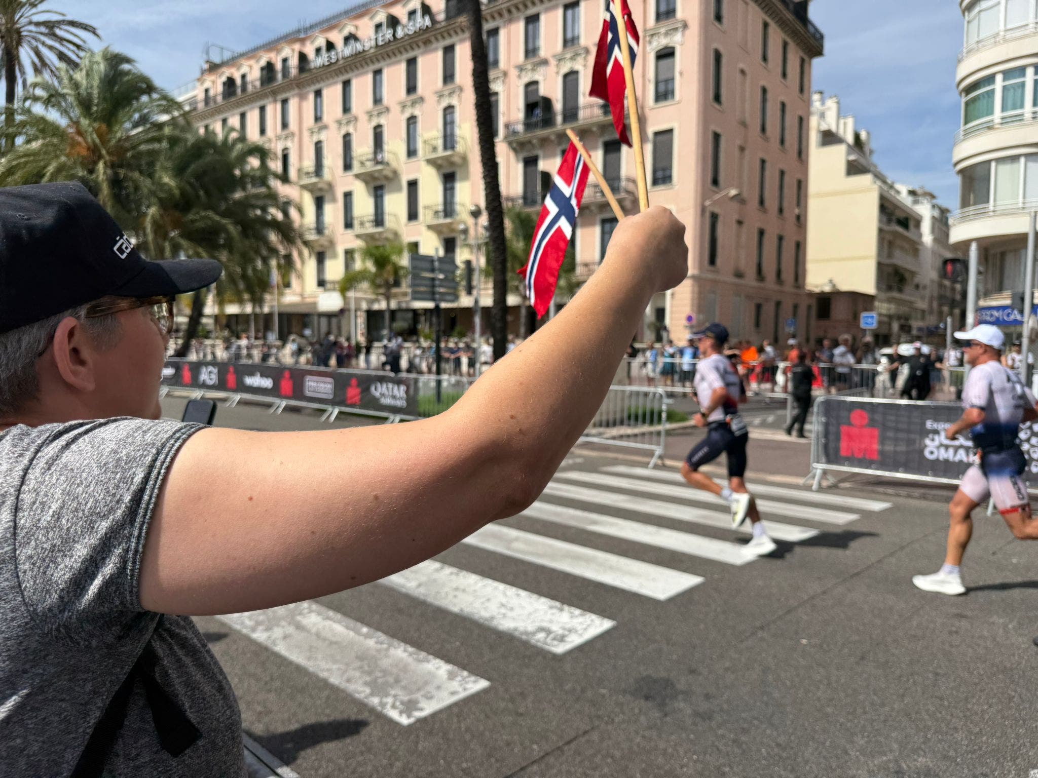 Norwegian fan Turid cheers on Gustav Iden and Kristian Blummenfelt at the men's 2025 Ironman World Championship