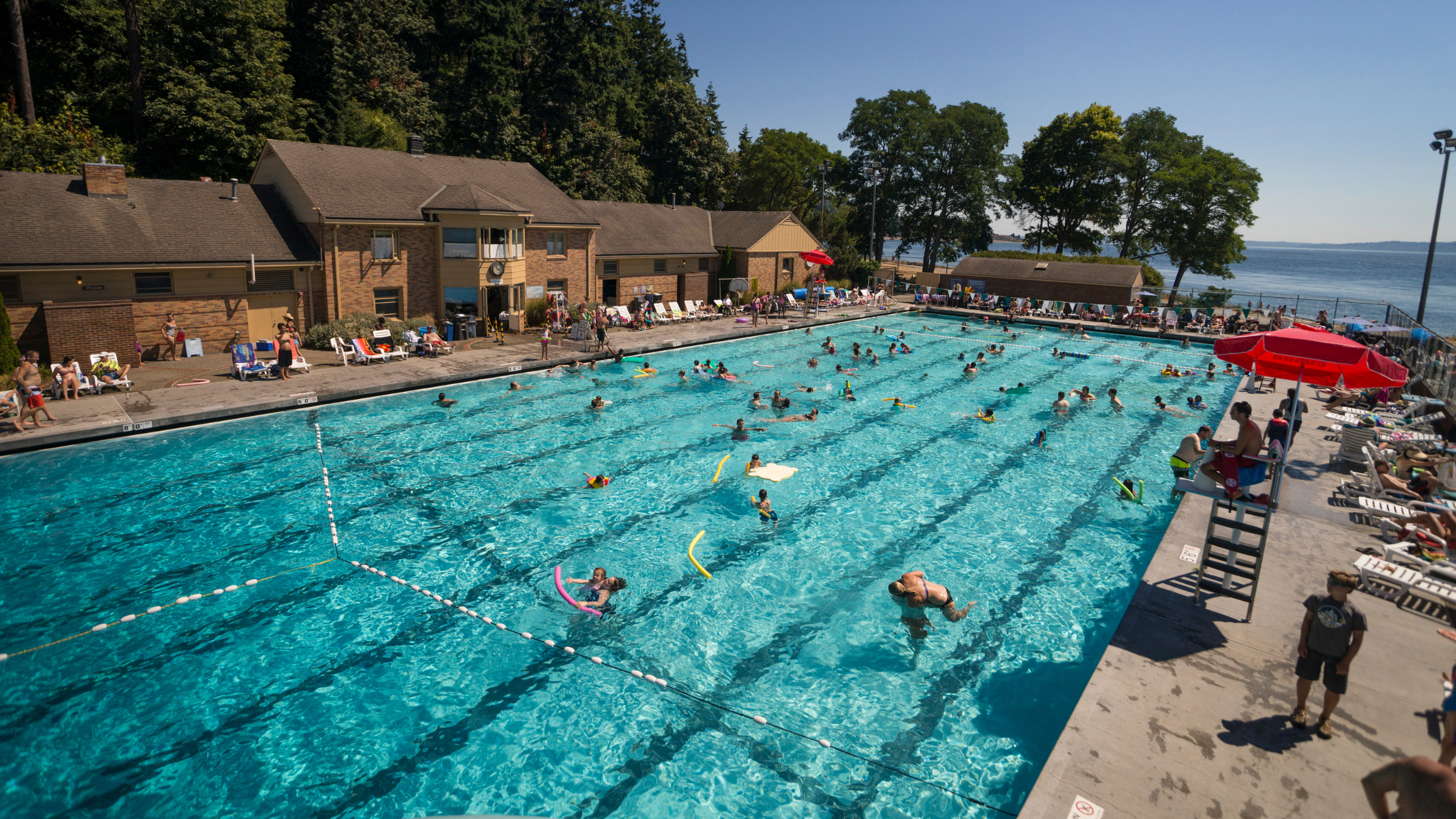 Overhead shot of the pool with woods, pool, Puget Sound in the background, and Coleman Basin