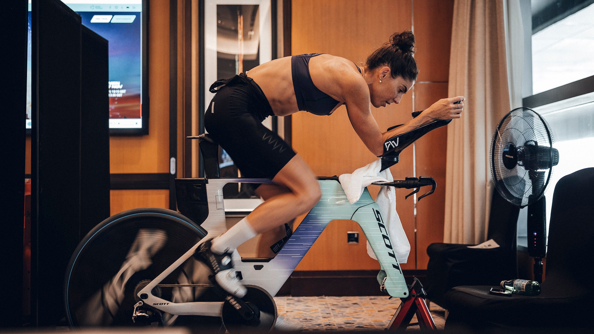 An athlete sits on the bike trainer for a lunchtime workout that builds strength and leads to better climbing.