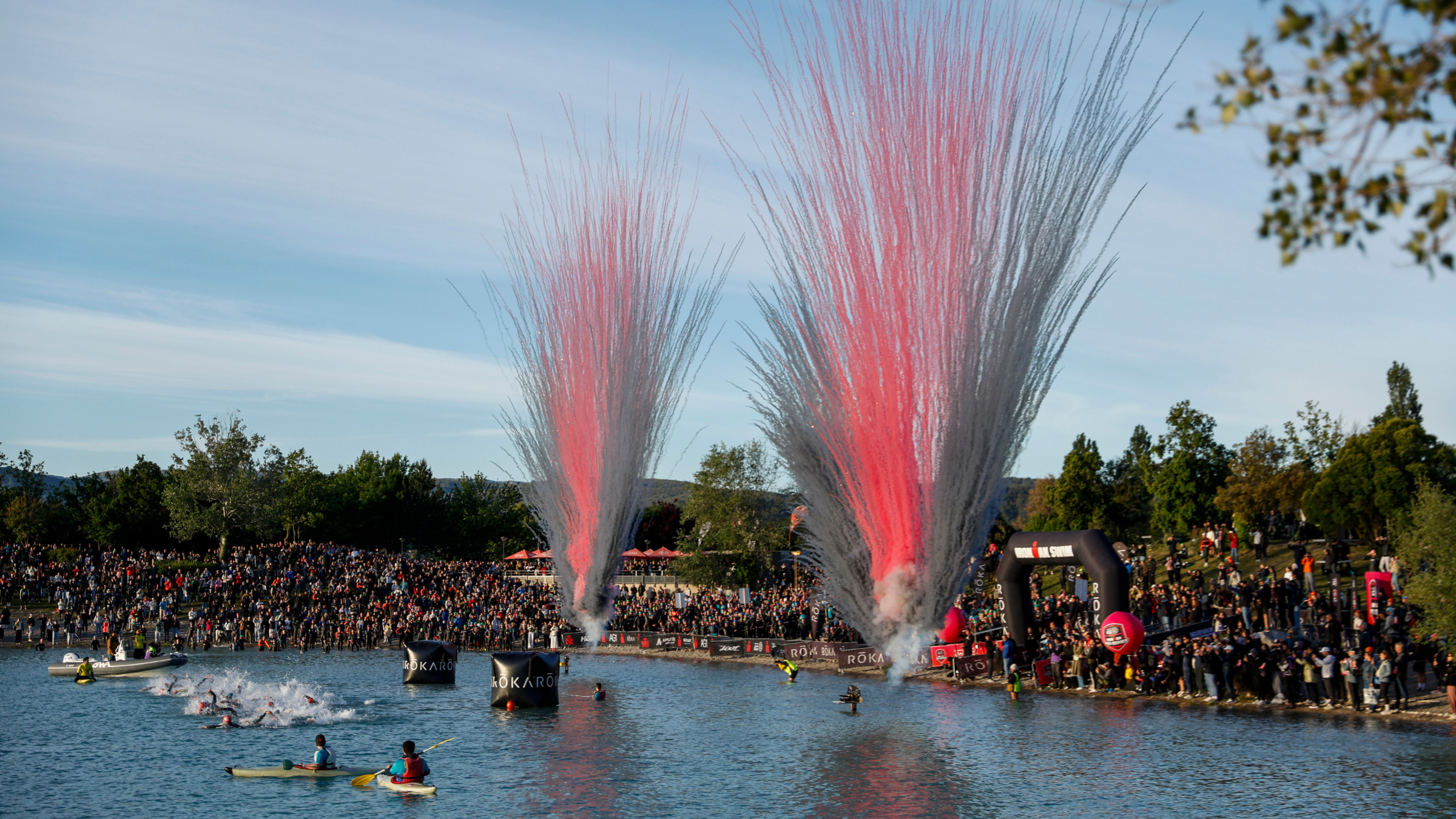 Triathlon swimming begins with crowds of people lining the beaches, Ironman 70.3 Aix-en-Provence