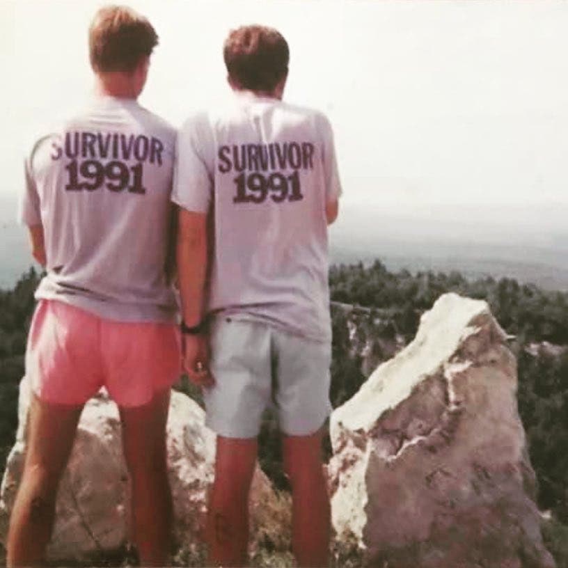 Athletes from the 1991 Survival of the Shawangunks Triathlon take in their accomplishments (and show off their finishers' T-shirts).