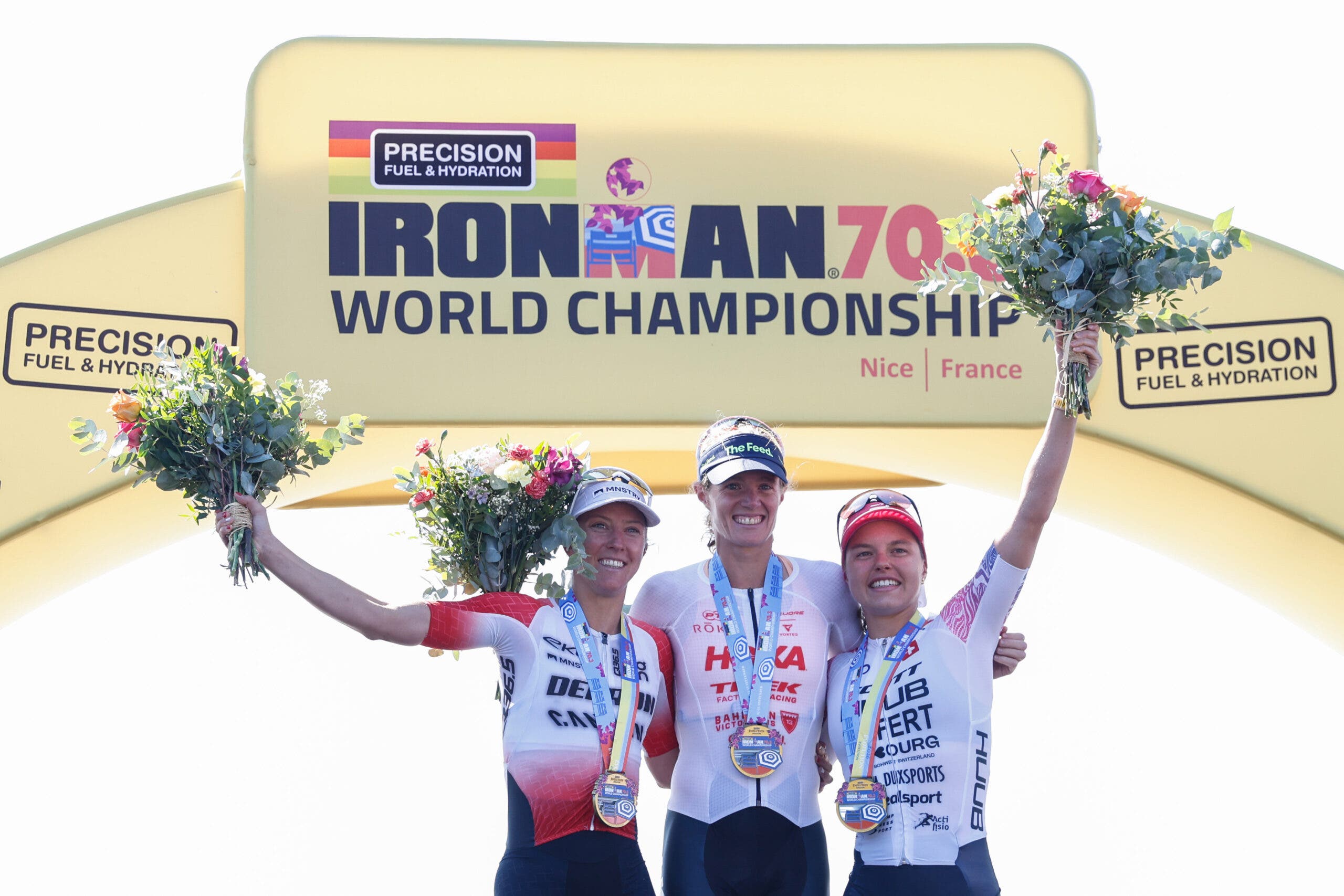 (L-R) Julie Derron of Switzerland, Taylor Knibb of USA and Alanis Siffert of Switzerland celebrate on the podium during the Ironman 70.3 World Championship Women's Race on September 12, 2026 in Nice, France.