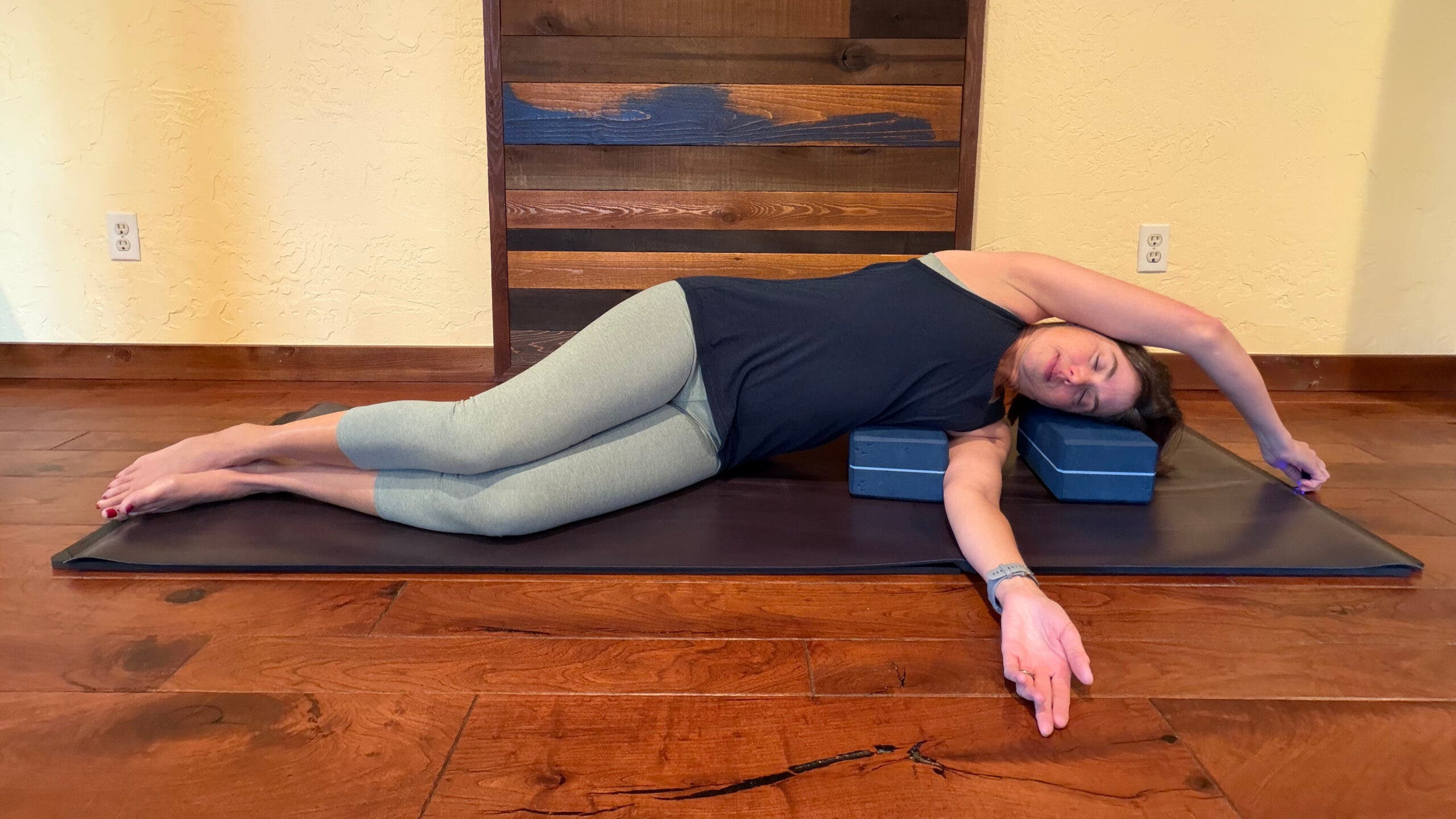 Carrie Lehtonen demonstrates a supported side-lying stretch.
