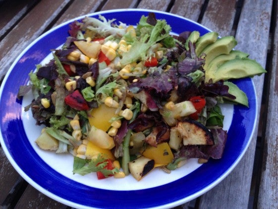 Salad with greens, corn, and avocado